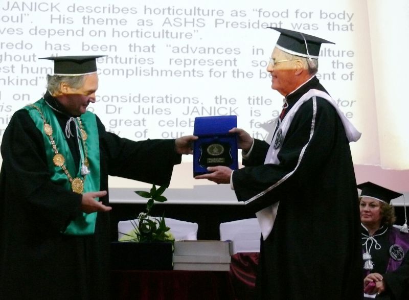 Rector Doru Pamfil giving DHC medal to Professor Jules Janick
